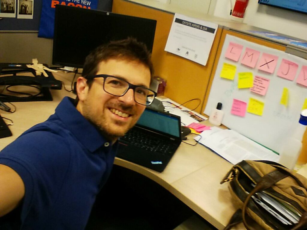 Andrea De Mauro working at his desk.